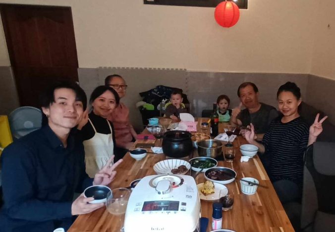 My wife and her family around our table for a New Year's dinner.